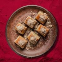 Baklava Boom · Layers of filo pastry dressed with syrup and garnished with walnuts.