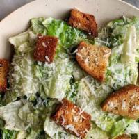 Caesar Salad · Romaine lettuce, garlic croutons, parmigiana cheese and Caesar dressing.