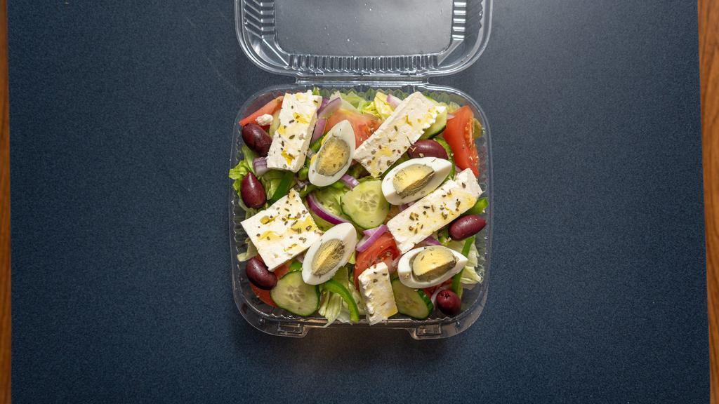 Greek Salad · Garden salad with feta cheese, black olives and egg.