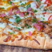 Jamaican Jerk Flatbread · Smoked Jerk Chicken, Caramelized Onions, Red Peppers, Pickled Red Onions, Parsley, Pineapple...