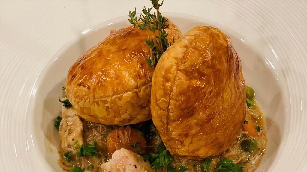 Chicken Pot Pie · Chicken, Peas, Carrots, Herbs, Creamy Chicken Gravy, topped with a Fluffy Puff Pastry