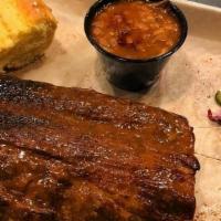 1/2 Rack Of Ribs Plate · Served with a side of Baked Beans, Chef's Slaw & Cornbread.