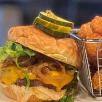 Smash Burger · 8oz Burger, Shaved Lettuce, Sautéed Onions, Thousand Island Dressing, Cheddar Cheese