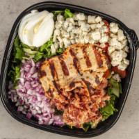 Cobb Salad · grilled chicken, romaine, bacon, tomatoes, crumbled blue cheese, hard boiled egg & red onion.