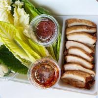 Pork Belly Bossam Box · Tender pork belly poached in Korean traditional spices, sliced and served with assorted lett...