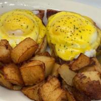 Eggs Benedict · 2 poached eggs on a choice of ham, bacon, sausage, hash or veggies with hollandaise sauce on...