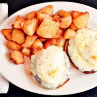 Big Apple Melt · 2 poached eggs on a choice of ham, bacon, sausage, hash or veggies with melted cheese on toa...