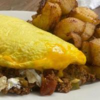Taco Omelet · Ground beef with onion, pepper, salsa, cheddar, taco chips, and sour cream.
