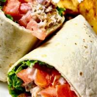 Grilled Chicken Caesar Wrap · Grilled chicken with romaine lettuce, croutons, and Parmesan cheese tossed with Caesar dress...