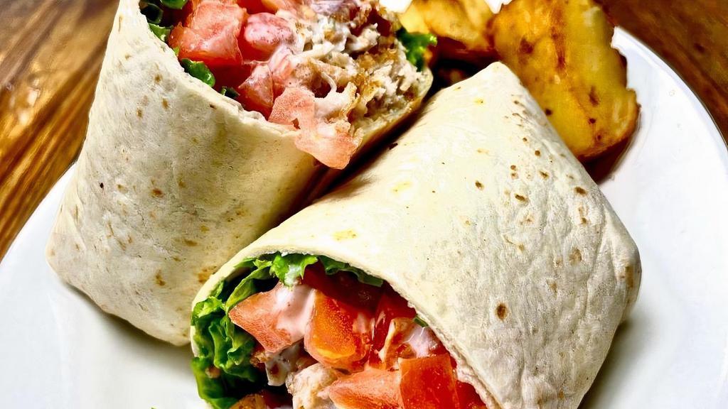 Grilled Chicken Caesar Wrap · Grilled chicken with romaine lettuce, croutons, and Parmesan cheese tossed with Caesar dressing.