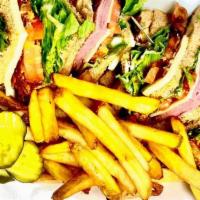 Ham & Cheese Club Sandwich · 3 decks high with bacon, lettuce, tomato, and mayo. Served with fries or onion rings and a p...