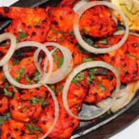 Tandoori Prawns · Jumbo prawns marinated in a special blend of spices of herbs then roasted in the tandoor. Se...