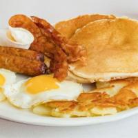 Hungry Man Feast Breakfast  · 2 hot cakes or 2 slice French toast, 2 eggs any style, 2 slices of bacon or 2 sausage,  grits.