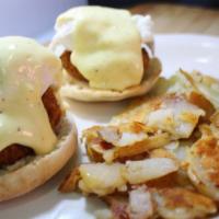 Crab Cake Benny · Two crab cakes served over english muffin topped with two eggs & mustard sauce served with h...