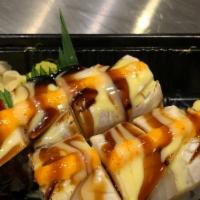 Irashai Maki · Spicy salmon and mango topped with yellowtail and white tuna lightly torched drizzled in che...