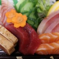 Sashimi Deluxe · Eighteen pieces of sashimi from our chef's assortment. Served with seaweed salad.. Item serv...