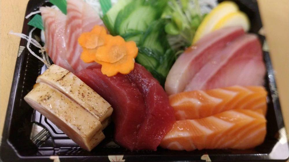Sashimi Deluxe · Eighteen pieces of sashimi from our chef's assortment. Served with seaweed salad.. Item served raw.