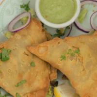 Vegetable Samosa · Seasoned potatoes, green peas and house spices wrapped in a light deep fried pastry dough. o...