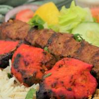 City Combo#1 · 3 pieces of boneless chicken 1 skewer of sheekh kabob .  served with basmati rice, chickpeas...
