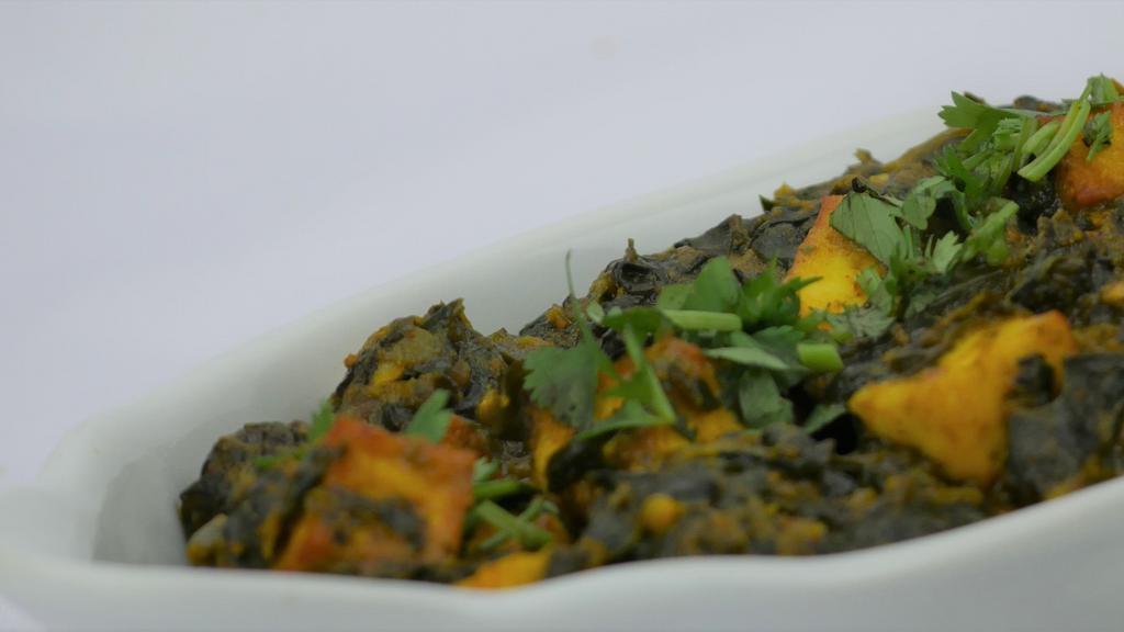 Saag Paneer · Fresh spinach and cottage cheese served with basmati rice.