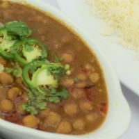 Chana Masala · Garbanzo beans cooked with onion, tomatoes and house spices, served with basmati rice.