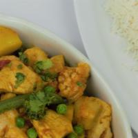 Chicken Jalfraize · Chicken cooked with fresh tomatoes, onions, green peppers, and house spices, served with bas...