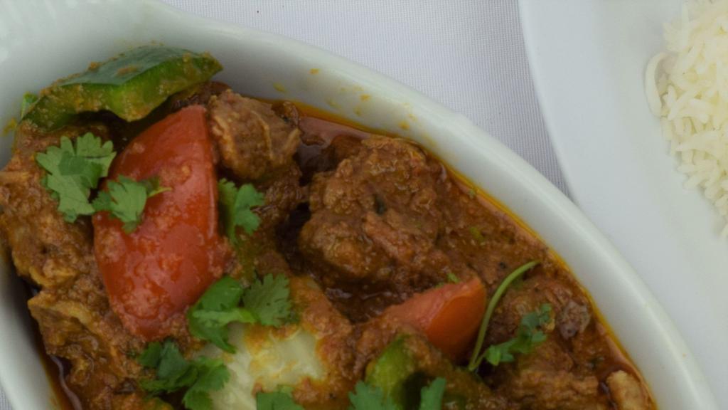Lamb Kadai · Lamb cooked with fresh ginger, garlic cilantro, diced tomatoes, with house spices, served with basmati rice.