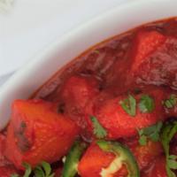 Shrimp Vindaloo · Large prawns and potatoes cooked in fiery hot sauce and house spices, served with basmati ri...