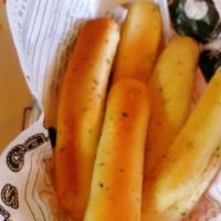 Garlic Bread Stick (4) · 4 pieces. buttery bread that is topped with garlic.