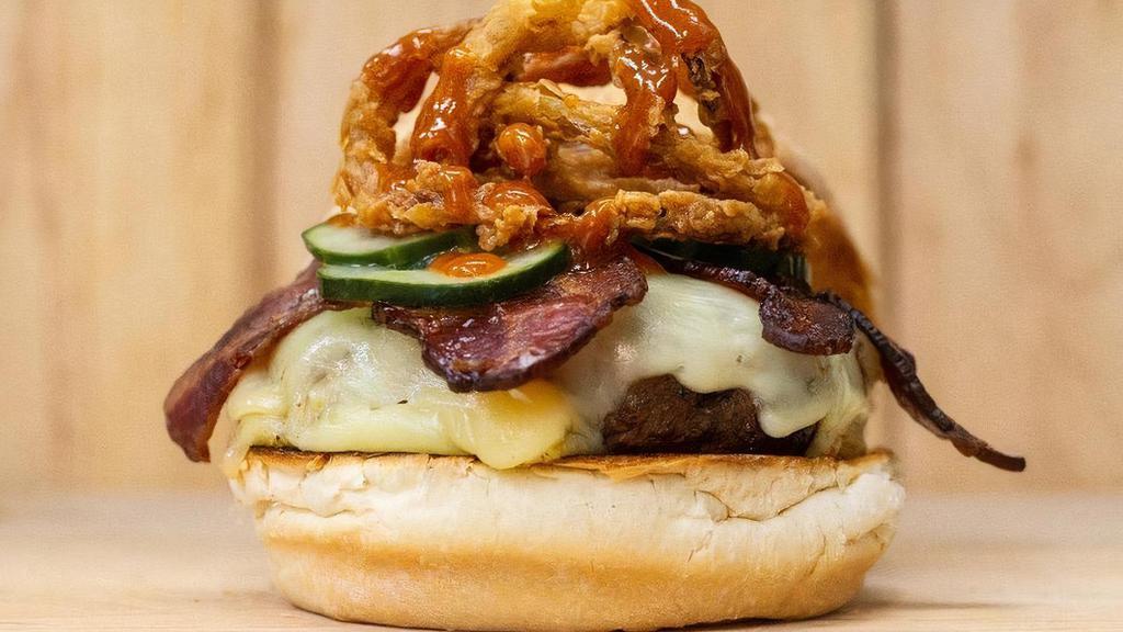 Smokehouse Burger · Gouda, Bacon, Fried Onions, Pickles, House BBQ Sauce