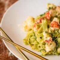 Green Curry Lobster Fettuccine · lobster, handmade fettuccine pasta, white wine, thai green curry coconut cream sauce