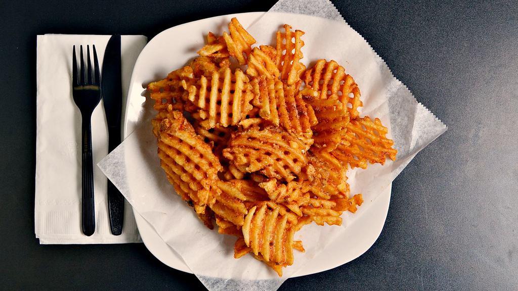 Seasoned Waffle Fries · (6 oz.) Lightly breaded, thick-cut waffle fries, seasoned with our house secret spice and deep-fried to perfection.