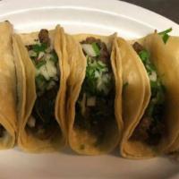 (3) Tacos · Three soft shell corn tortilla filled with meat of choice, onions and cilantro.