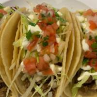 (3) Taco Supreme · Three soft shell tacos with meat of choice, lettuce, sour cream, cheese and pico de gallo.