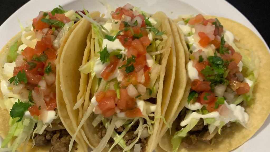 (3) Taco Supreme · Three soft shell tacos with meat of choice, lettuce, sour cream, cheese and pico de gallo.