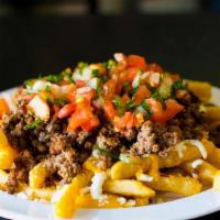 Papas Supreme · French fries covered in cheese, sour cream, pico de gallo and ground beef.