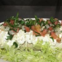 Burrito · Burrito filled with meat of choice refried beans, rice lettuce topped with cheese, sour crea...