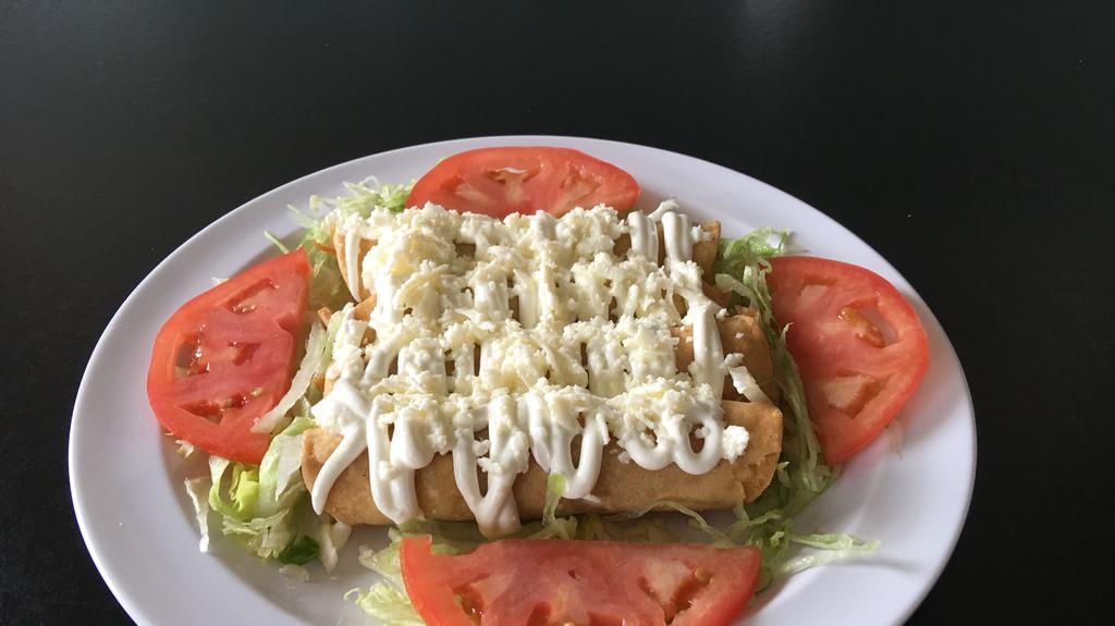 Flautas · Four fried taquitos with meat of choice topped with sour cream and cheese with a bed of lettuce and tomato.