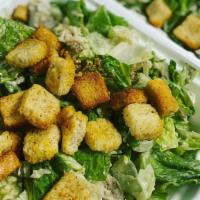 Caesar Salad · Romaine lettuce, shaved Parmesan cheese, Caesar dressing, seasoned croutons.