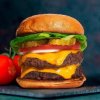 Dolly Double Cheese Burger · Two American beef patties topped with melted cheese, lettuce, tomato, onion, and pickles. Se...