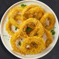 Ring Me Up · (Vegetarian) Sliced onions dipped in a light batter and fried until crispy and golden brown.