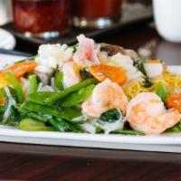 Seafood Pan Fried Noodle · Double pan fried egg noodle with shrimp, scallop, fish and mixed veg in ginger wine glazed s...