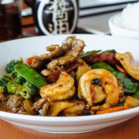 Four Seasons · Shrimp, chicken, beef, roasted pork and vegetables in black bean sauce. Served with steamed ...