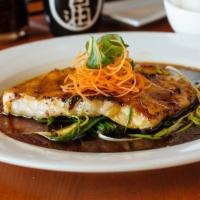 Pan Seared Chilean Sea Bass · Served with steamed rice and brown rice.