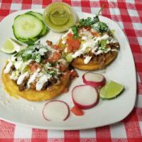 Sopes · Steak, al pastor, chicken or chorizo topped with refried beans, fresh lettuce, pico, and sou...