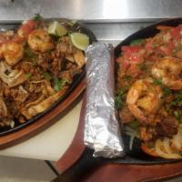 Paraiso Rosel Fajitas · delicious fajitas mix with chicken,steak,shrimp,chorizo and carnitas!! served with rice,  be...