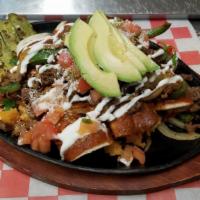 Enchiladas Rancheras · Four cheese enchiladas topped with mole sauce, and your choice of sautéed fajita meat ( chic...