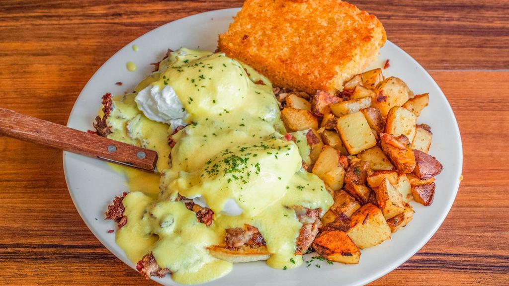 Irish Eggs Benedict · A grilled English muffin topped with homemade hash, two poached eggs, and hollandaise sauce.