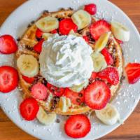 Chunky Monkey · Three fluffy buttermilk pancakes, waffles or French toast topped with fresh strawberries, ba...
