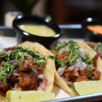 Al Pastor (Tacos) · Marinated pork with pineapple.
